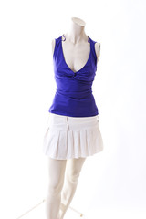 Blue top with mini skirt summer style on mannequin full body shop display. Woman fashion styles, clothes on white studio background.