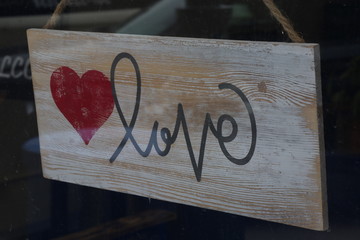 Love Sign with Heart on Weathered Wood