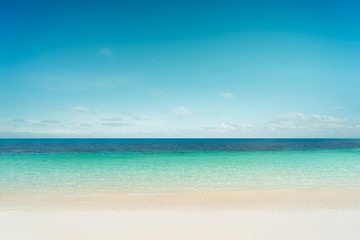 Fototapeta na wymiar Tropical beach and sea with sunny sky .