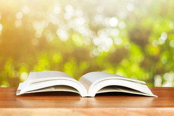 Open book on wood planks