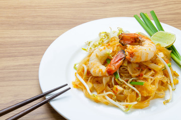 pad thai with shrimp on white dish  © piggu