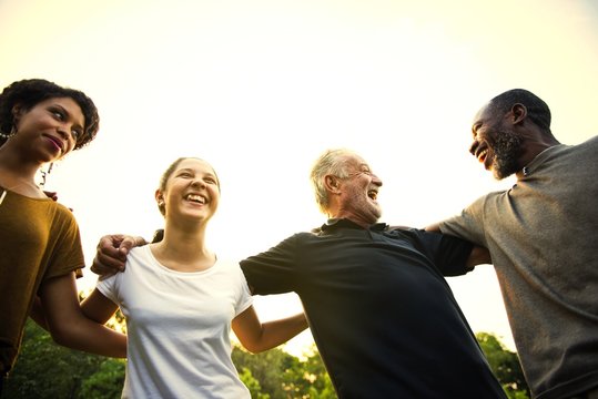 Friends Of All Ages Holding Hands