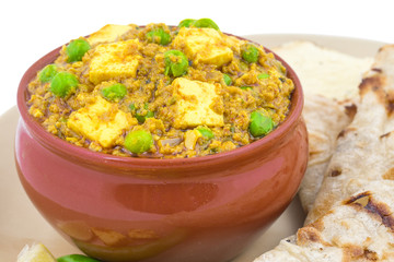 Indian Cuisine Mattar Paneer is a Vegetarian North Indian Dish Consisting of Peas And Paneer in a Tomato Based Sauce, Spiced with Garam Masala. It is often Served with Indian type of Tandoori Roti