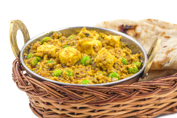 Indian Cuisine Mattar Paneer is a Vegetarian North Indian Dish Consisting of Peas And Paneer in a Tomato Based Sauce, Spiced with Garam Masala. It is often Served with Indian type of Tandoori Roti