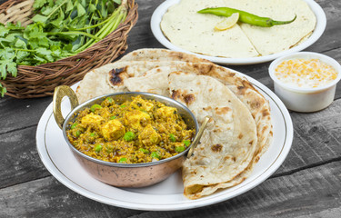 Indian Cuisine Mattar Paneer is a Vegetarian North Indian Dish Consisting of Peas And Paneer in a Tomato Based Sauce, Spiced with Garam Masala. It is often Served with Indian type of Tandoori Roti