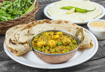 Indian Cuisine Mattar Paneer is a Vegetarian North Indian Dish Consisting of Peas And Paneer in a Tomato Based Sauce, Spiced with Garam Masala. It is often Served with Indian type of Tandoori Roti