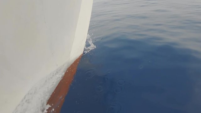 Close Up Shot On A Ships Bow Travelling Through The Calm Blue Sea.