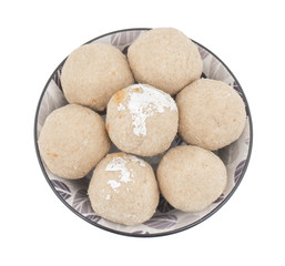 Fototapeta na wymiar Gehu Ke Laddu Indian Traditional Sweet Food Also Know as Wheat Laddu, Laddoos, laddoo, ladoo, laddo Are Ball-Shaped Sweets Popular in The Indian Festivals. isolated on White Background