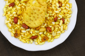 Indian Street Spicy Food Bhel puri is a savoury snack, and is also a type of chaat. It is made of puffed rice, vegetables and a tangy tamarind sauce.