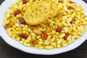 Indian Street Spicy Food Bhel puri is a savoury snack, and is also a type of chaat. It is made of puffed rice, vegetables and a tangy tamarind sauce.