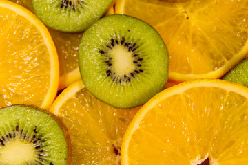 Fototapeta premium Background of the kiwi and orange fruits