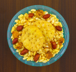 Indian Street Spicy Food Bhel puri is a savoury snack, and is also a type of chaat. It is made of puffed rice, vegetables and a tangy tamarind sauce.