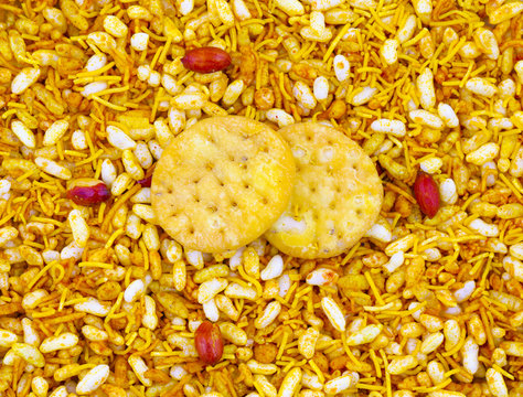 Indian Street Spicy Food Bhel puri is a savoury snack, and is also a type of chaat. It is made of puffed rice, vegetables and a tangy tamarind sauce.