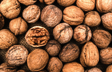 Uncleaned in the shell fresh organic walnuts background image