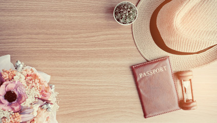 top view work space, travel on holidays, relax, passport with hat and camera on wooden background, flat lay traveler
