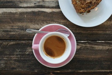 Pink coffee cup on the table