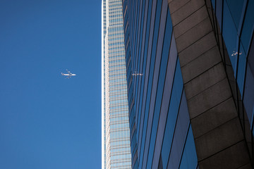 Wall of skyscraper business office with a airplane silhouette