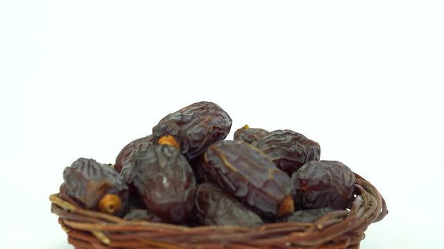 Delicious fresh organic palm dates over white background