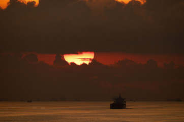 Merchant ship in sunset