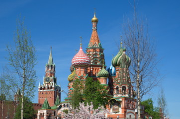 Cathedral of the Intercession of the Holy virgin, the Moat (St. Basil's Cathedral) and the Spasskaya tower of the Moscow Kremlin on a Sunny spring day, Russia