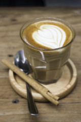 Cup of piccolo latte coffee with latte art