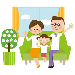 Obraz premium ポップな眼鏡のパパとその家族 ソファーでハーイ