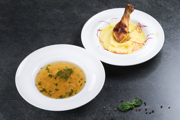 Complex dinner. Mashed potatoes with chicken leg appetizing on a white plate