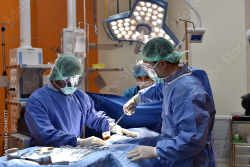 Medical Team Performing Surgical Operation In Modern