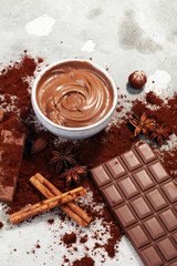 Chocolate bars on table with chocolate powder.