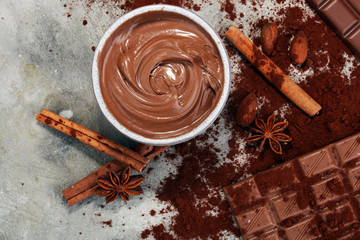 Chocolate bars on table with chocolate powder.