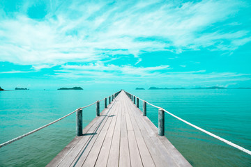 Landscape of wooden bridge in blue sea on tropical beach . vintage toned , Fashion, travel, summer, vacation and tropical beach . Creative made of Landscape .