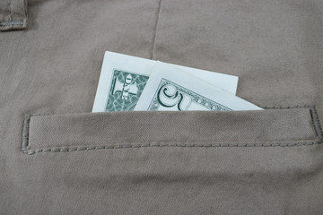 money in pants pockets, 5 dollars in jeans pockets