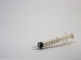 Plastic syringe, place for text, close-up