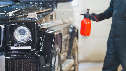 Washing a luxury car in the suds