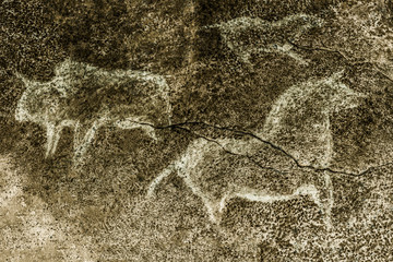 An image of ancient animals depicted on the wall of a cave. ancient history. drawings of an ancient man. ancient art.