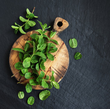 Green mint on a old wooden board