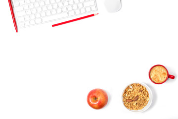 Beautiful light mockup. White modern keyboard, mouse, pencils, pen, plate with granola and small red cup of coffee on white background. Healthy snack at office. Top view.