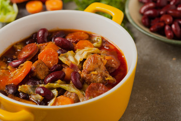 Traditional portuguese goulash with cabbage, beans and ribs.