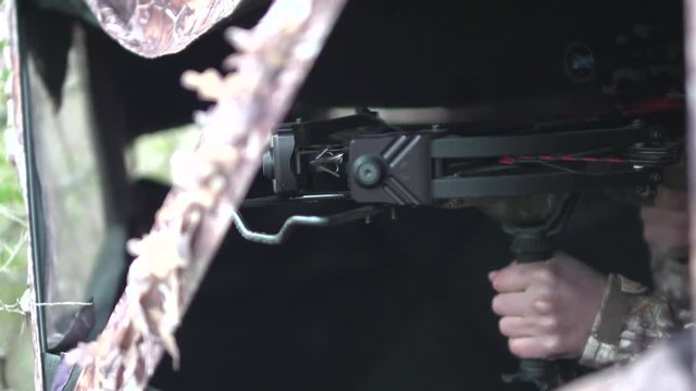 hunter hunting with a crossbow