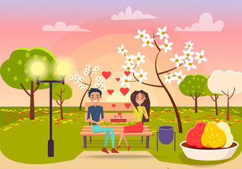 Young Male and Female Sits on Bench and Holds Gift