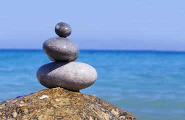 Fototapeta na wymiar Spa stones balance on beach .