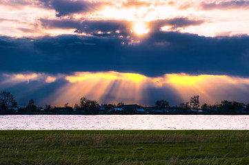 Divine sunset on the lake near the village