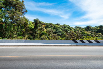 Country road on the mountain with blue sky in sunny day.