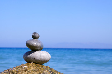 Spa stones balance on beach .