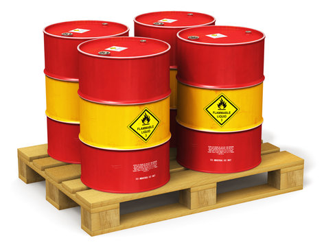 Group of red oil drums on shipping pallet isolated on white