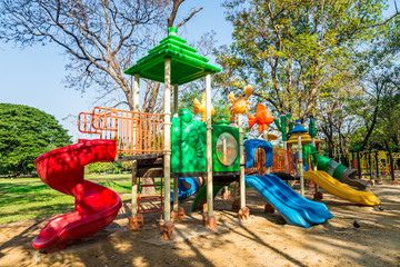 Fototapeta na wymiar Outdoor children playground in green nature city park