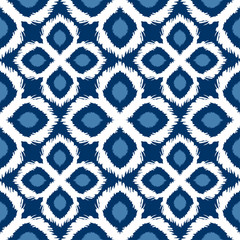 Seamless ikat pattern in yellow and grey colors.  tribal background