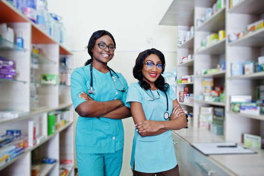 Two african american pharmacist working in drugstore at hospital pharmacy. African healthcare.