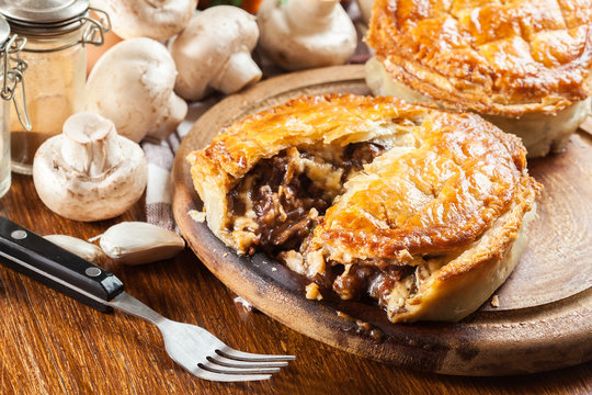 Fresh beef stew pie on a cutting board