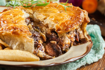 Homemade beef stew pie with french fries